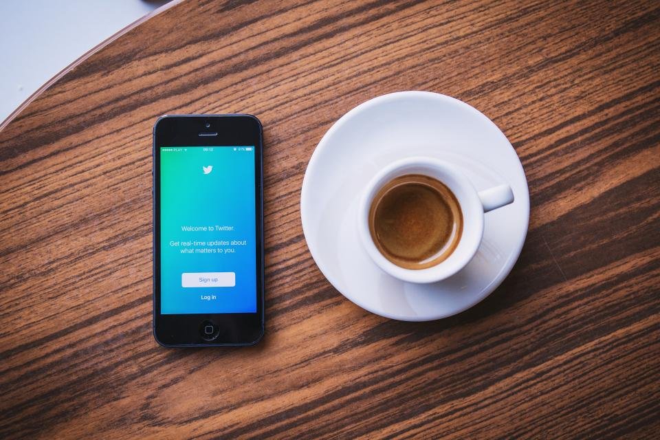 Smartphone and espresso on a desk for Meta Ads in the UAE