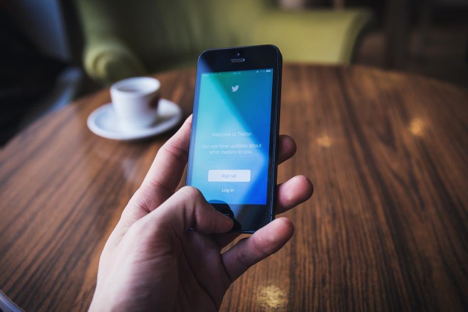 Hands holding a smartphone with social media for Meta Ads in Saudi Arabia